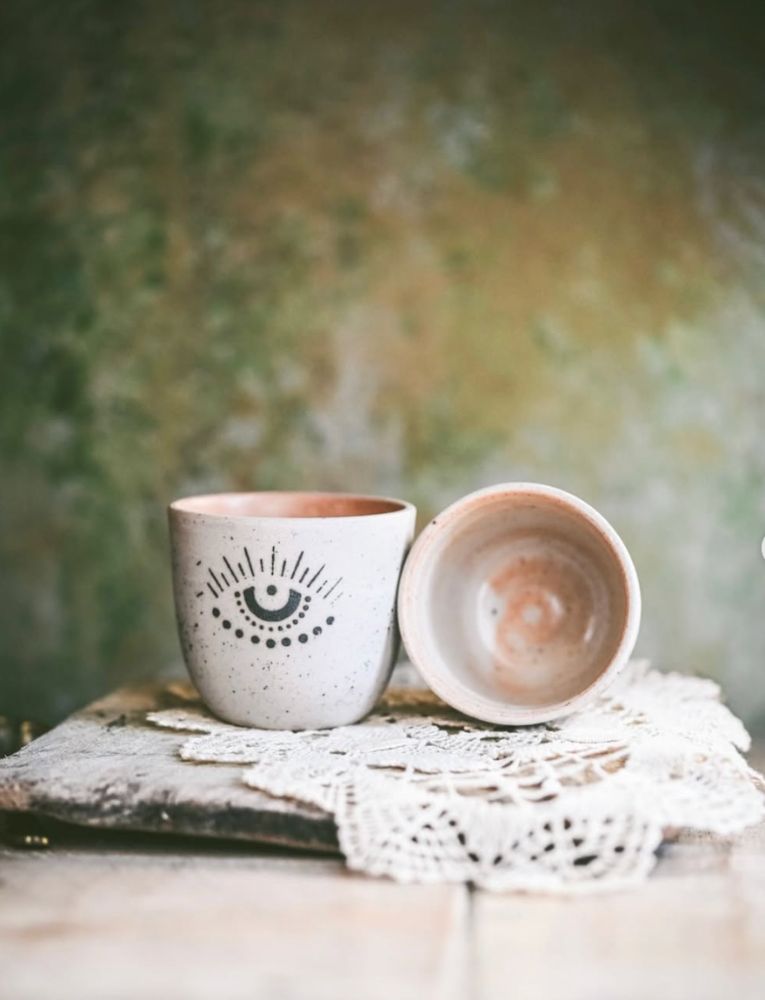 Hand-thrown ceramic cup with evil-eye motif